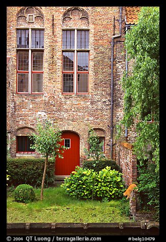 Brick house with small garden by the canal. Bruges, Belgium (color)