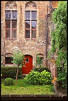 Brick house with small garden by the canal. Bruges, Belgium