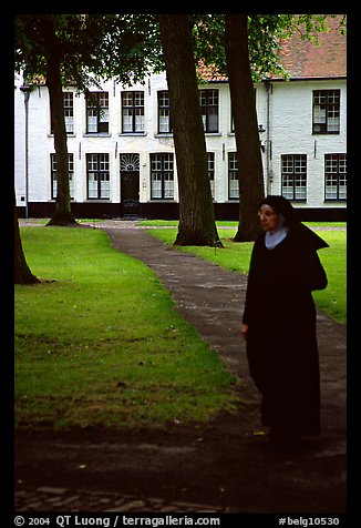 Benedictine nun in the Begijnhof. Bruges, Belgium