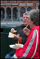 Elderly women eating fries. Bruges, Belgium ( color)