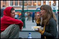 Young woman eating fries, Markt. Bruges, Belgium ( color)