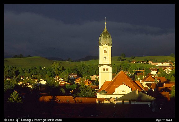 Nesselwang and St Andreas church, storm light. Bavaria, Germany (color)