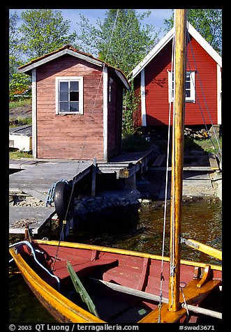 Boat and cabins. Gotaland, Sweden (color)