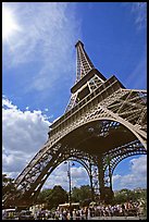 Eiffel tower and sun with crowds at base. Paris, France (color)