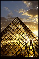 Louvre pyramid transparent at sunset. Paris, France (color)
