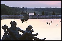 Sculptures, basin, and gardens at dusk, Palais de Versailles. France ( color)