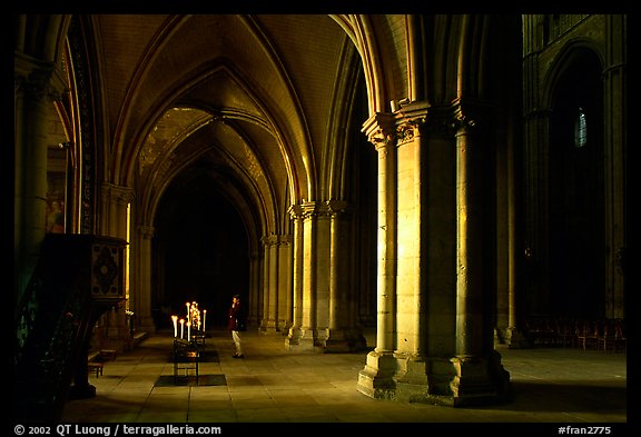 Worshiper inside the Saint-Etienne Cathedral. Bourges, Berry, France (color)