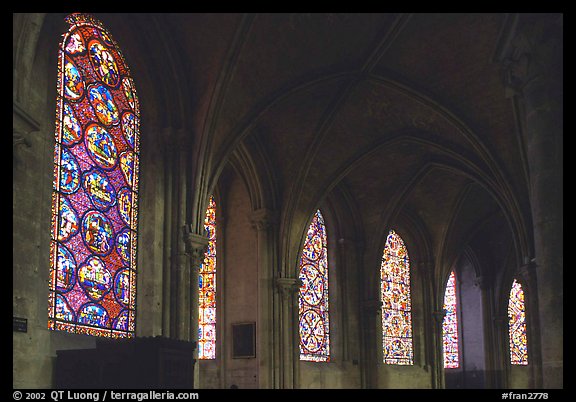 Aisle with tained glass windows, Saint-Etienne Cathedral. Bourges, Berry, France (color)