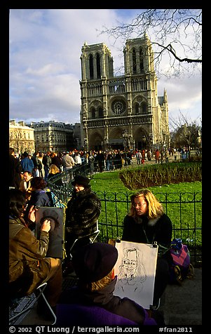 Sketch drawers in front of Notre Dame Cathedral. Paris, France