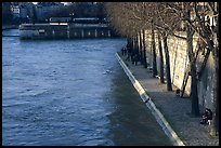 Walking on the banks of the Seine on the Saint-Louis island. Paris, France ( color)