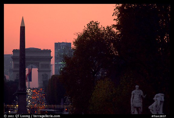 Obelisk of the Concorde and Arc de Triomphe at sunset. Paris, France