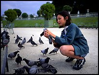 Girl feeding pigeon, Jardin du Luxembourg. Quartier Latin, Paris, France ( color)