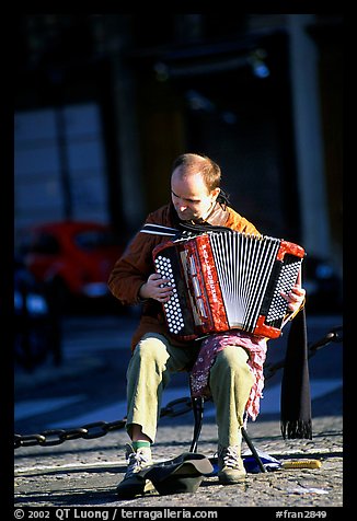 Accordeon player on the street. Paris, France (color)