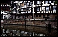 Half-timbered houses reflected in canal. Strasbourg, Alsace, France (color)