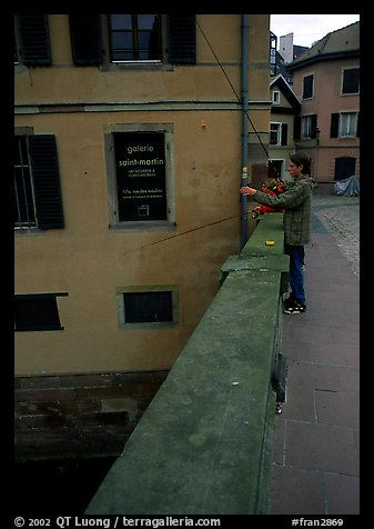 Fishing in a canal. Strasbourg, Alsace, France (color)