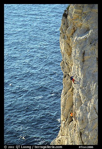 Rock climbing above water in the Calanque de Morgiou. Marseille, France (color)