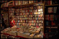 Checking a book in Shakespeare and Company bookstore. Quartier Latin, Paris, France (color)