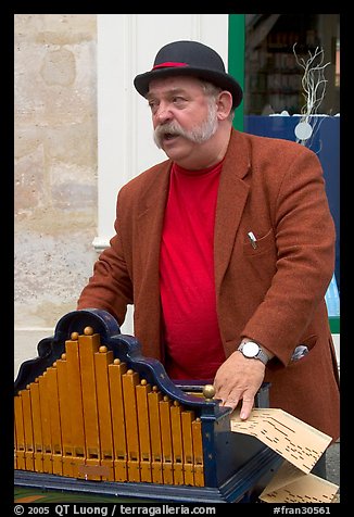Street musician with Barrel organ. Quartier Latin, Paris, France
