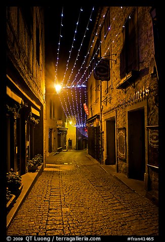 Medieval street by night with Christmas decorations and. Carcassonne, France (color)