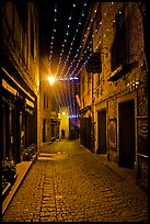 Medieval street by night with Christmas decorations and. Carcassonne, France ( color)
