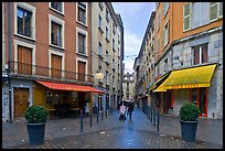 Pedestrian street with couple pushing stroller. Grenoble, France (color)
