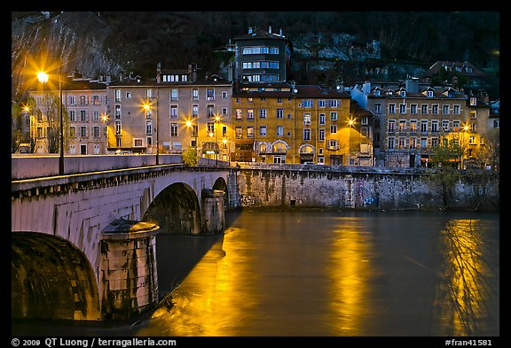 Isere River, Citadelle stone bridge and old houses at dusk. Grenoble, France (color)