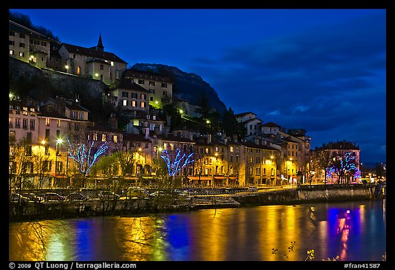 Night view with Isere River and illuminations reflected. Grenoble, France