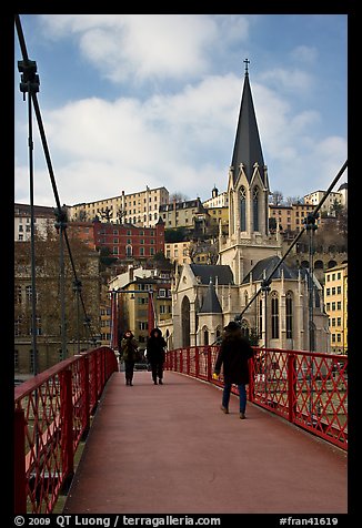 Walking across the passerelle Saint-Georges. Lyon, France