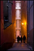 Silhouettes in staircase on Fourviere Hill at dusk. Lyon, France (color)