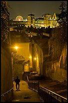 Man walking down stairs from Fourviere Hill, with St-Jean Cathedral below. Lyon, France (color)
