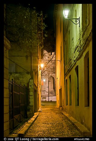 Narrow street leading to Palais des Papes at night. Avignon, Provence, France (color)