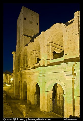 Arenes Roman amphitheater with defensive tower at night. Arles, Provence, France (color)
