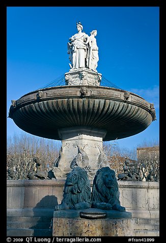 Monumental fountain with three statues representing art, justice and agriculture. Aix-en-Provence, France (color)