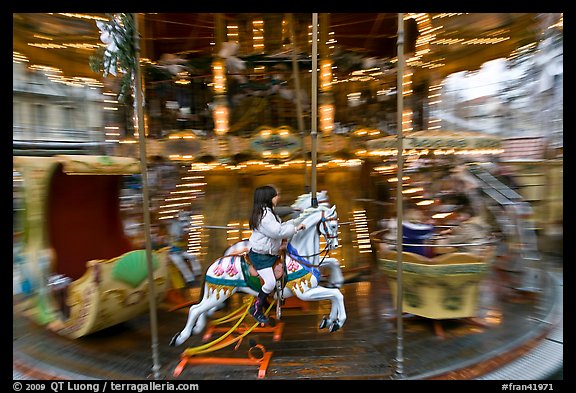 Girl on horse carousel. Avignon, Provence, France