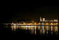 Avignon skyline at night with lights reflected in Rhone River. Avignon, Provence, France