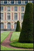 Hedged trees and facade, Palace of Fontainebleau. France