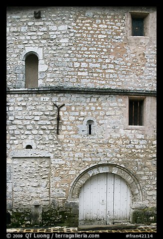 Facade detail of medieval house with small windows, Provins. France