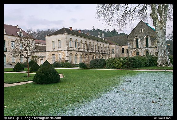 Lawn and forge in winter, Abbaye de Fontenay. Burgundy, France