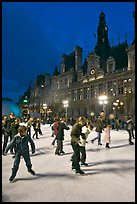 Holiday skaters, Hotel de Ville by night. Paris, France