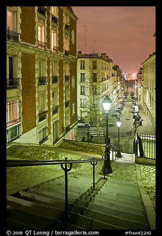 Stairs and street lamps by night, Butte Montmartre. Paris, France