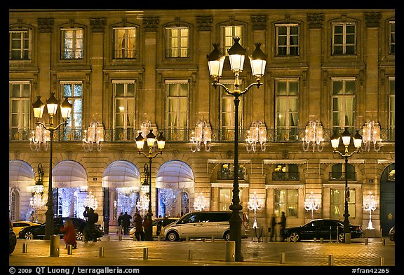 Lights and palace-like classical fronts of Hotel Ritz by Jules Hardouin-Mansart. Paris, France