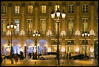Lights and palace-like classical fronts of Hotel Ritz by Jules Hardouin-Mansart. Paris, France