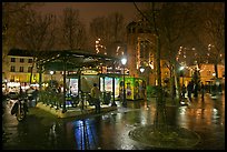 Public square on rainy night. Paris, France (color)