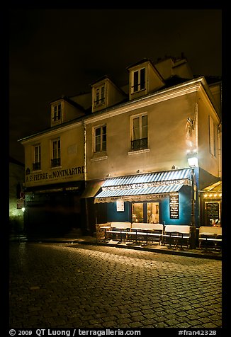Houses with restaurant at street level, Montmartre. Paris, France (color)