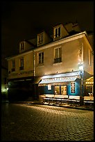 Houses with restaurant at street level, Montmartre. Paris, France