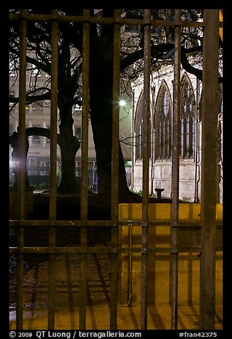 Cluny thermes behind iron grids by night. Quartier Latin, Paris, France