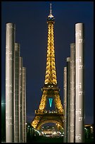 Columns of memorial to peace end Eiffel Tower by night. Paris, France ( color)