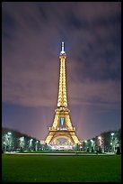 Lawns of Champs de Mars and Eiffel Tower at night. Paris, France