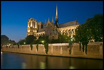 Side view of Notre Dame across Seine River at dusk. Paris, France ( color)