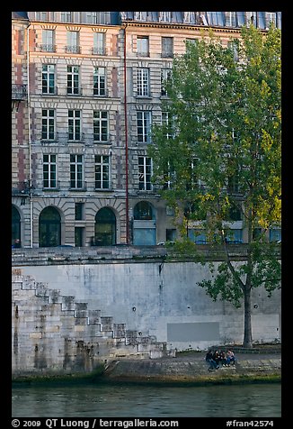 Quay and riverfront buildings on banks of the Seine. Paris, France